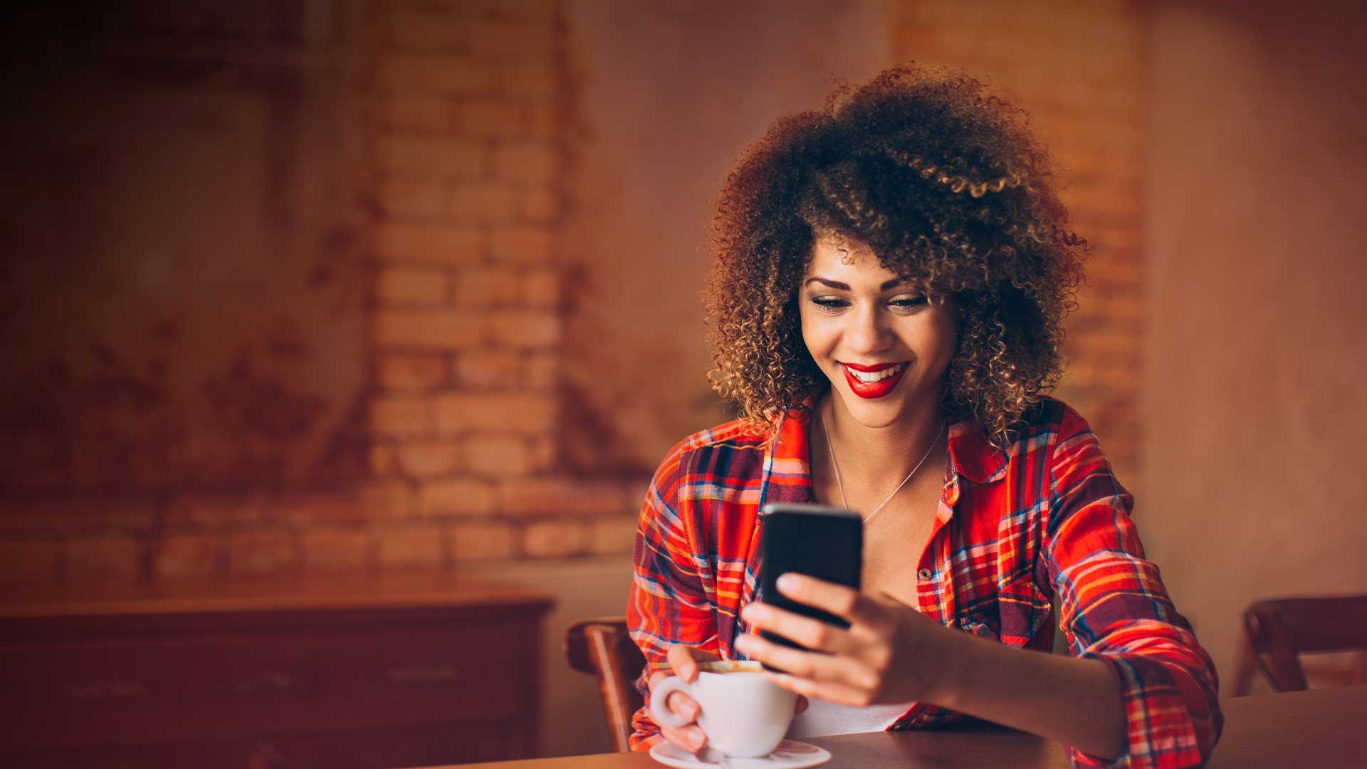 A member checking her Access Credit Bank balance on her phone